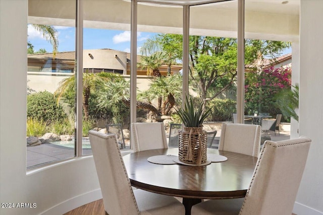 sunroom / solarium featuring a healthy amount of sunlight