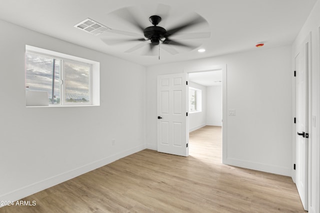 unfurnished room with ceiling fan and light hardwood / wood-style flooring