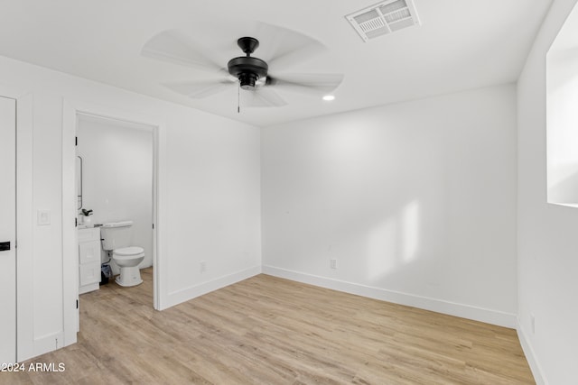 spare room with ceiling fan and light hardwood / wood-style flooring