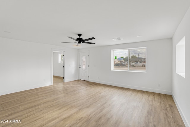 unfurnished room featuring ceiling fan and light hardwood / wood-style flooring