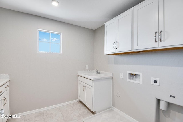 laundry area with hookup for a washing machine, hookup for a gas dryer, cabinet space, hookup for an electric dryer, and a sink