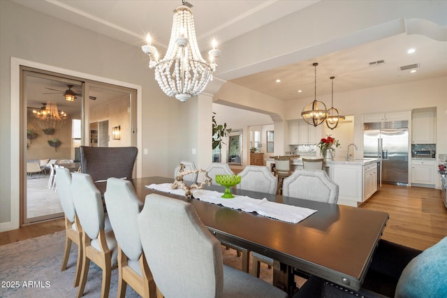6535 W Gold Mountain Pass, Phoenix, AZ 85083 - dining space with light wood-style floors, visible vents, recessed lighting, and a chandelier