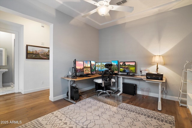 6535 W Gold Mountain Pass, Phoenix, AZ 85083 - home office with baseboards, ceiling fan, and wood finished floors