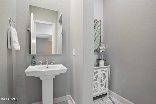 6535 W Gold Mountain Pass, Phoenix, AZ 85083 - bathroom with a sink, baseboards, and marble finish floor