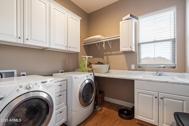 6535 W Gold Mountain Pass, Phoenix, AZ 85083 - laundry area with a sink, cabinet space, wood finished floors, and washing machine and clothes dryer