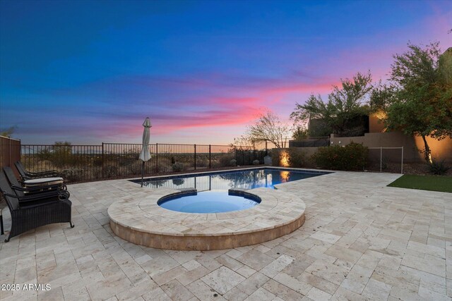 6535 W Gold Mountain Pass, Phoenix, AZ 85083 - pool at dusk with a patio, an in ground hot tub, a fenced in pool, and a fenced backyard