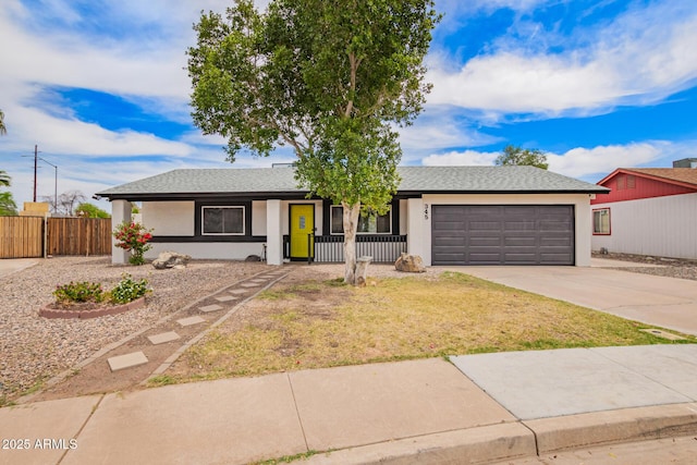 ranch-style home featuring a porch, a garage, fence, concrete driveway, and stucco siding