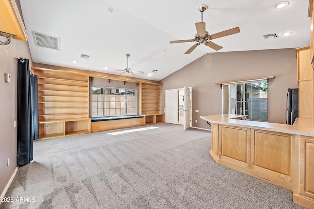 7949 W Pershing Ave, Peoria, AZ 85381 - unfurnished living room with light carpet, healthy amount of natural light, a ceiling fan, baseboards, and vaulted ceiling