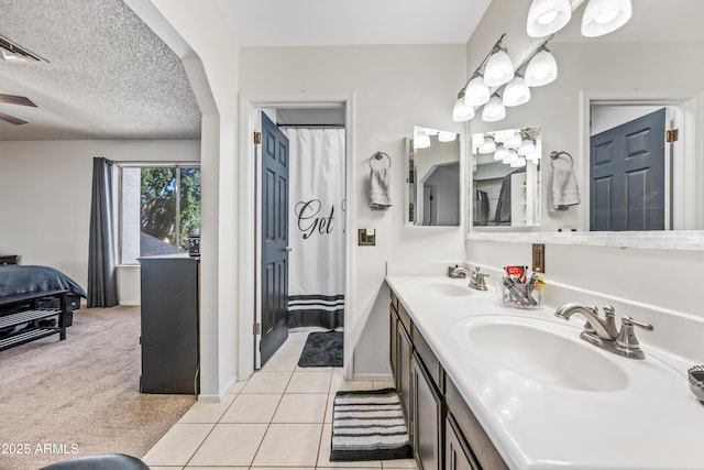 7949 W Pershing Ave, Peoria, AZ 85381 - full bathroom featuring baseboards, tile patterned floors, double vanity, and a ceiling fan