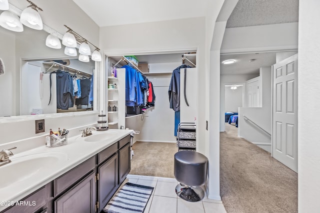 7949 W Pershing Ave, Peoria, AZ 85381 - full bath with a spacious closet, double vanity, and tile patterned floors
