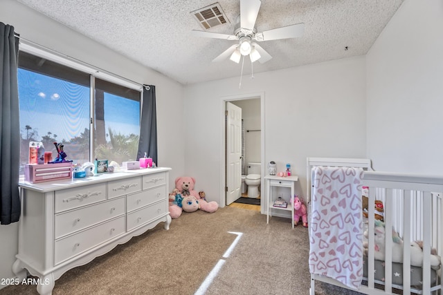 7949 W Pershing Ave, Peoria, AZ 85381 - carpeted bedroom featuring a textured ceiling and a nursery area
