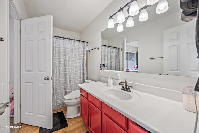 7949 W Pershing Ave, Peoria, AZ 85381 - full bathroom with wood finished floors, vanity, and toilet