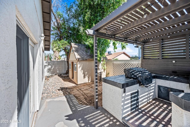 7949 W Pershing Ave, Peoria, AZ 85381 - view of patio / terrace featuring fence, a storage unit, an outbuilding, and a pergola