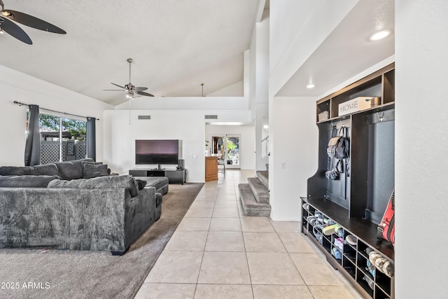 7949 W Pershing Ave, Peoria, AZ 85381 - living room featuring a ceiling fan, light tile patterned floors, and lofted ceiling
