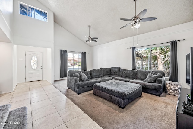 7949 W Pershing Ave, Peoria, AZ 85381 - living area featuring light carpet, high vaulted ceiling, ceiling fan, light tile patterned floors, and a textured ceiling