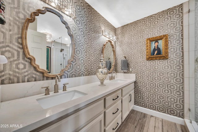 3109 E Sierra Madre Way, Phoenix, AZ 85016 - full bath with wallpapered walls, double vanity, an enclosed shower, and wood finished floors