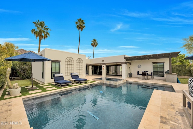 3109 E Sierra Madre Way, Phoenix, AZ 85016 - back of house featuring a patio, stucco siding, and a pool with connected hot tub