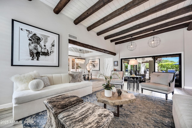 3109 E Sierra Madre Way, Phoenix, AZ 85016 - living area featuring wood finished floors, a wood ceiling with exposed beams, and a chandelier
