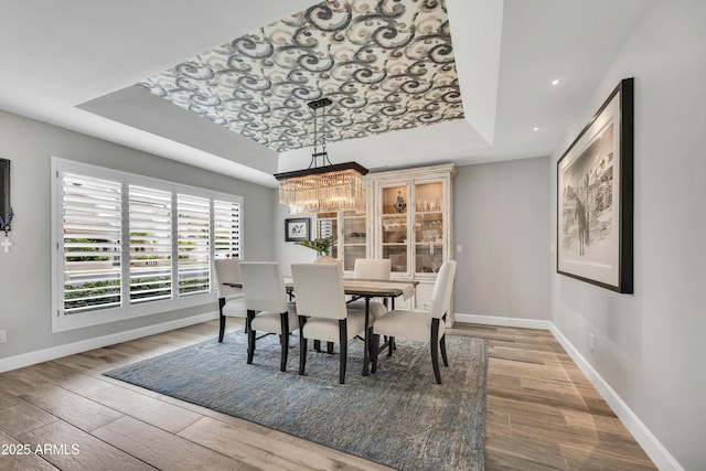 3109 E Sierra Madre Way, Phoenix, AZ 85016 - dining room with a raised ceiling, a chandelier, wood finished floors, and recessed lighting