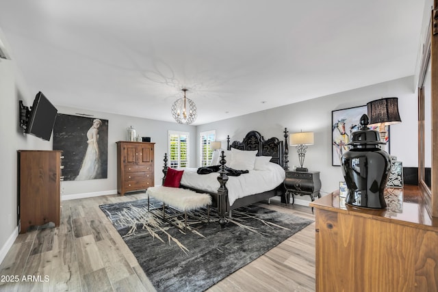 3109 E Sierra Madre Way, Phoenix, AZ 85016 - bedroom featuring a chandelier and light wood finished floors