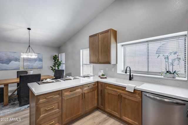 2730 E Desert Trumpet Rd, Phoenix, AZ 85048 - kitchen with stainless steel dishwasher, a sink, lofted ceiling, light wood finished floors, and a peninsula