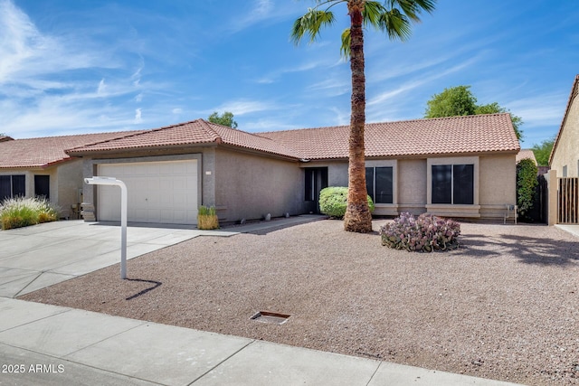 2730 E Desert Trumpet Rd, Phoenix, AZ 85048 - ranch-style home with stucco siding, a tiled roof, and a garage