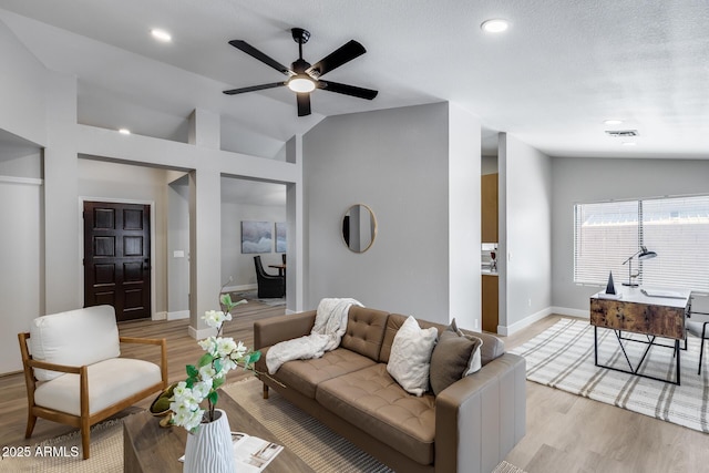 2730 E Desert Trumpet Rd, Phoenix, AZ 85048 - living room with vaulted ceiling, light wood finished floors, baseboards, ceiling fan, and recessed lighting