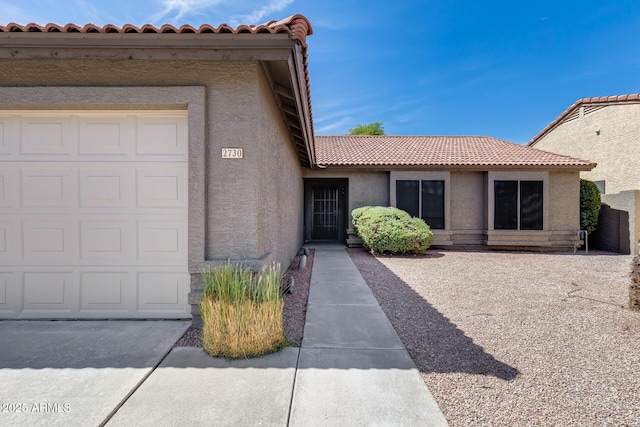 2730 E Desert Trumpet Rd, Phoenix, AZ 85048 - entrance to property featuring a tile roof, stucco siding, and a garage