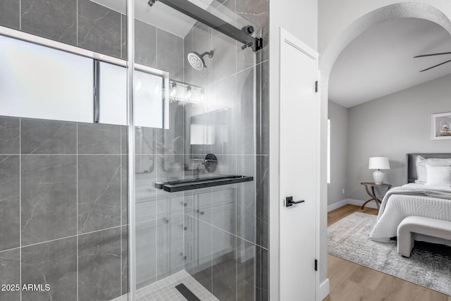 2730 E Desert Trumpet Rd, Phoenix, AZ 85048 - bathroom featuring a shower stall, wood finished floors, vaulted ceiling, and ensuite bath