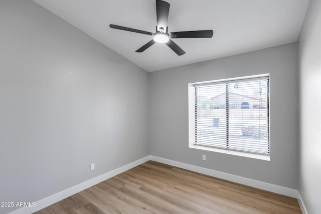 2730 E Desert Trumpet Rd, Phoenix, AZ 85048 - empty room featuring light wood finished floors, a ceiling fan, baseboards, and lofted ceiling
