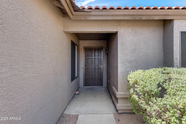 2730 E Desert Trumpet Rd, Phoenix, AZ 85048 - doorway to property featuring stucco siding and a tiled roof