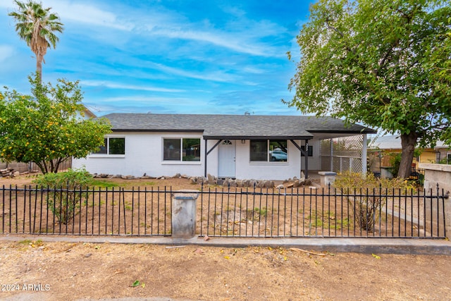 ranch-style home with a carport