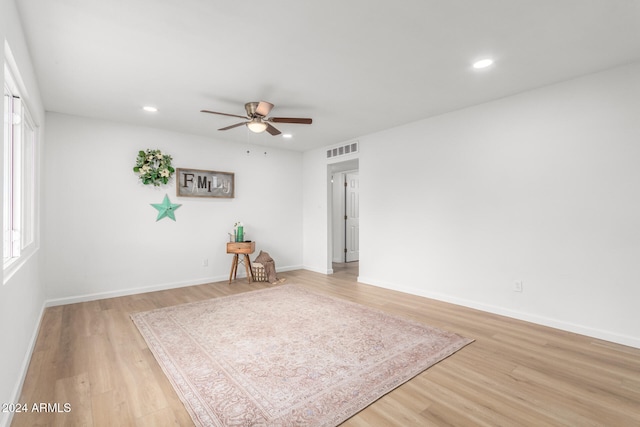 unfurnished room featuring ceiling fan and light hardwood / wood-style flooring