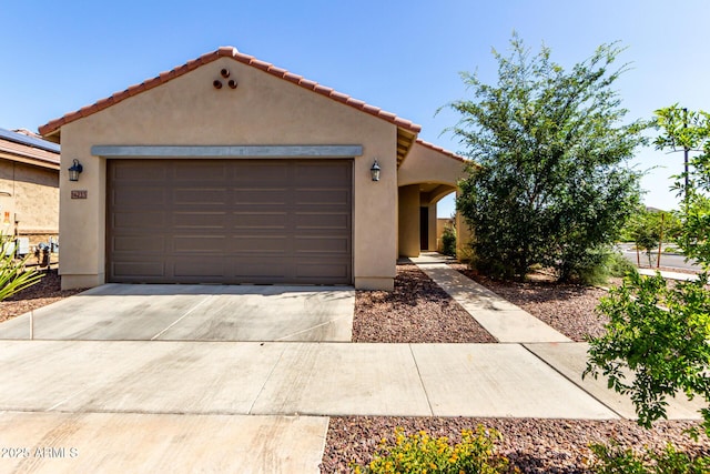 14233 W Georgia Dr, Surprise, AZ 85379 - mediterranean / spanish-style home featuring stucco siding, driveway, an attached garage, and a tile roof