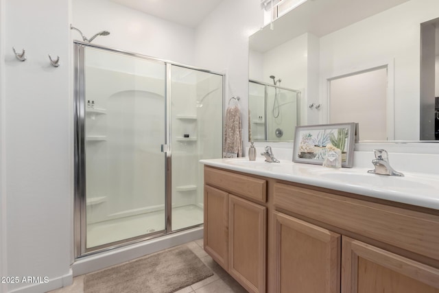 14233 W Georgia Dr, Surprise, AZ 85379 - bathroom featuring a shower stall, double vanity, and tile patterned floors