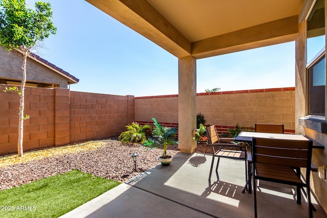 14233 W Georgia Dr, Surprise, AZ 85379 - fenced backyard featuring a patio and outdoor dining area