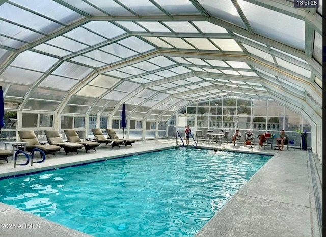 community pool featuring a patio area and a lanai