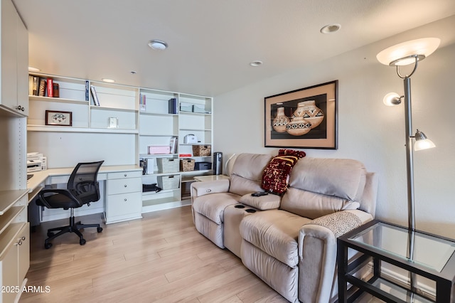 home office with light wood-style flooring