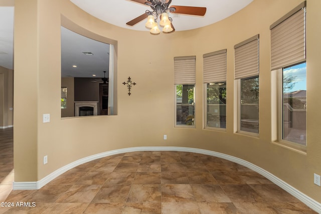 unfurnished room featuring ceiling fan