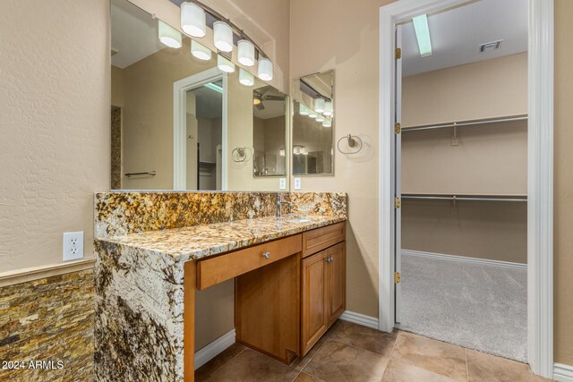 bathroom featuring tile patterned flooring and vanity