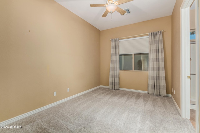 empty room with ceiling fan and carpet flooring