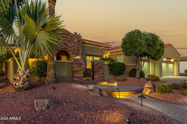 view of front of property with a garage