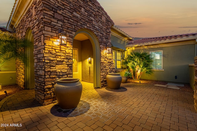 view of patio terrace at dusk