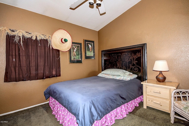 bedroom featuring lofted ceiling, dark colored carpet, and ceiling fan