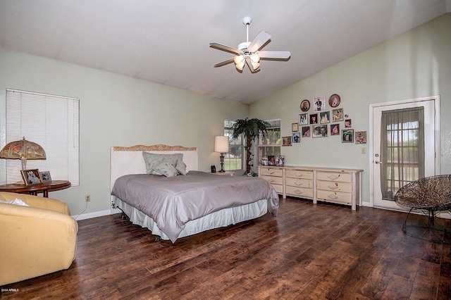 bedroom with dark wood-type flooring, vaulted ceiling, and ceiling fan