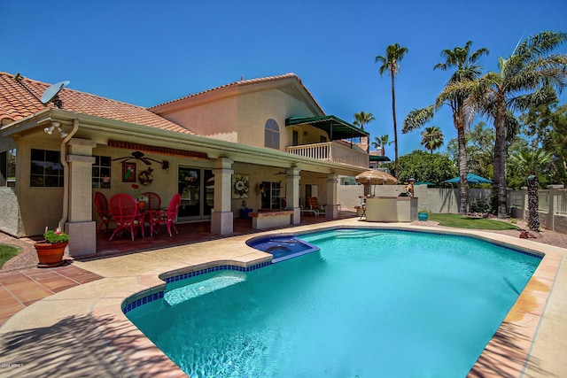 view of pool with a patio and ceiling fan