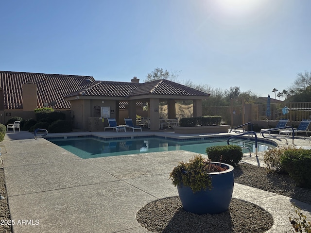 pool featuring a patio area, fence, and a gazebo