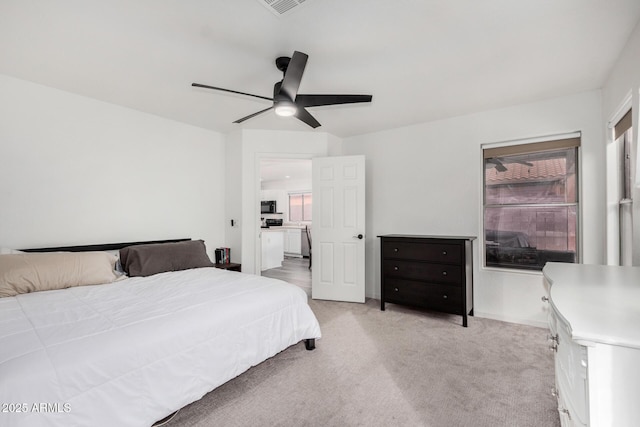 bedroom with light colored carpet and ceiling fan