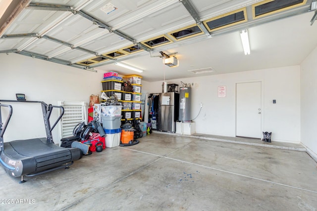 garage with stainless steel refrigerator, a garage door opener, and water heater