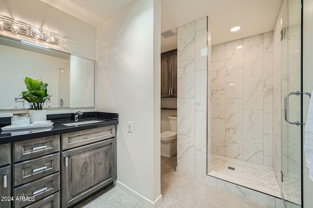 bathroom featuring walk in shower, vanity, and toilet